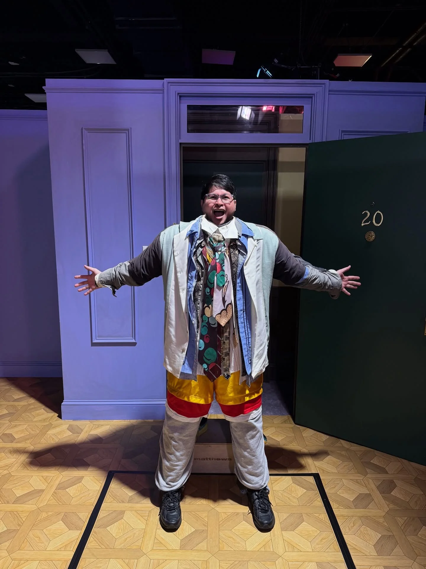 Fun and James in costume on a theater set
