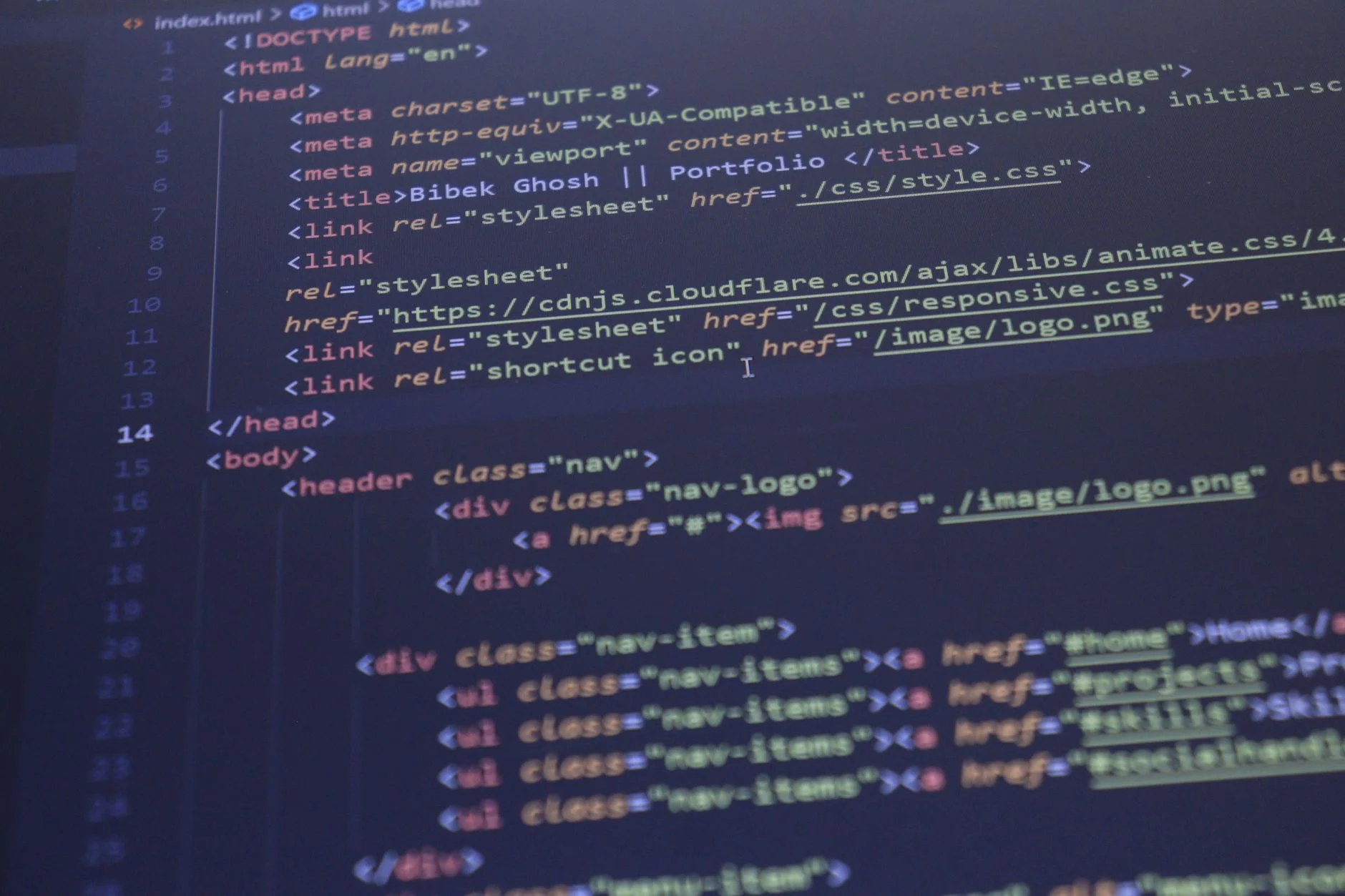 Close-up view of HTML and CSS code displayed on a computer screen, ideal for programming and technology themes.