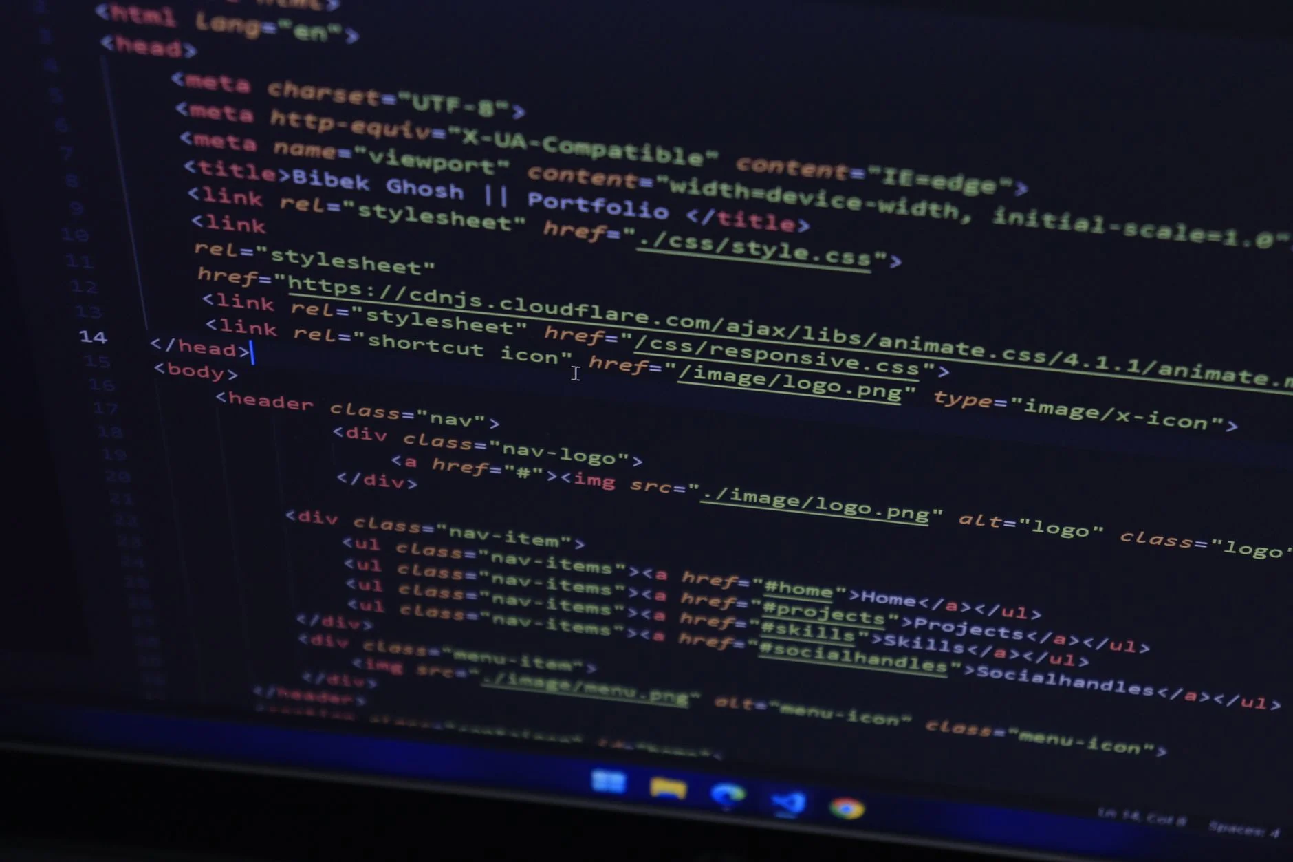 High-resolution close-up of HTML code displayed on a computer screen, perfect for technology themes.