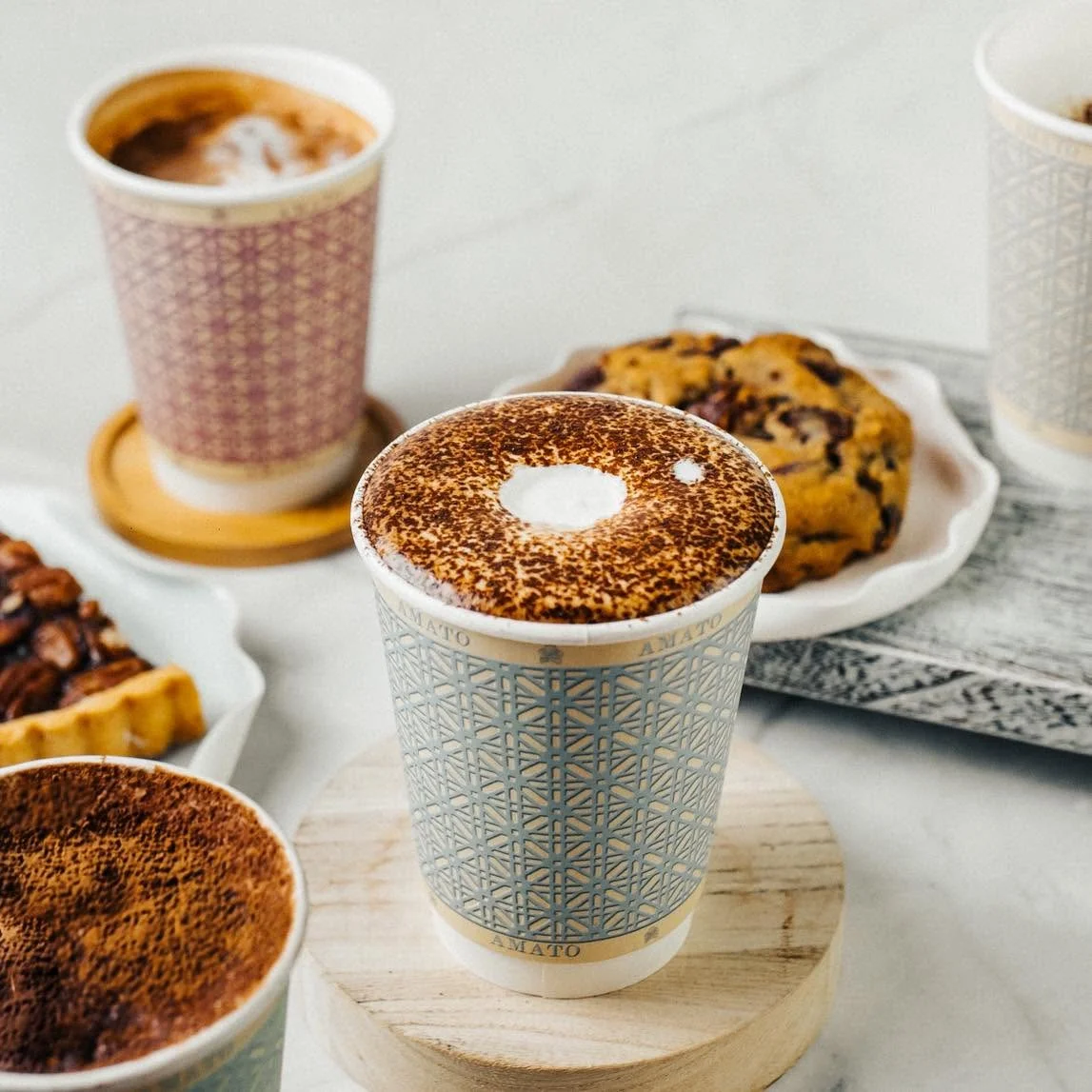 Cappuccino with cocoa dusting and assorted treats